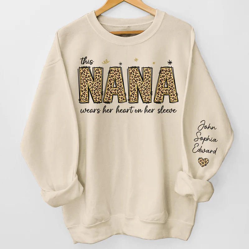 This Nana Wears Her Heart On Her Sleeve - Family Personalized Unisex Sweatshirt With Design On Sleeve - Birthday Gift For Mom, Grandma