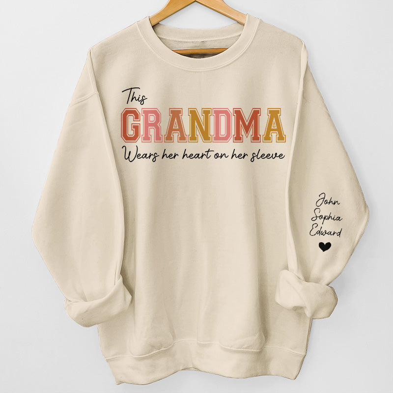 Mommy‘s Heart Belongs To - Family Personalized Custom Unisex Sweatshirt With Design On Sleeve