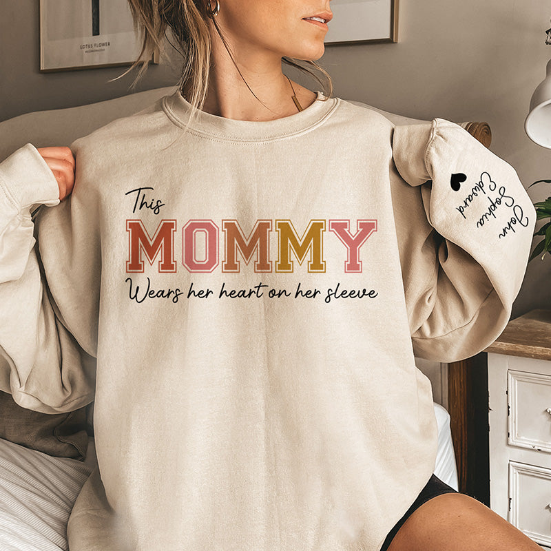 Mommy‘s Heart Belongs To - Family Personalized Custom Unisex Sweatshirt With Design On Sleeve