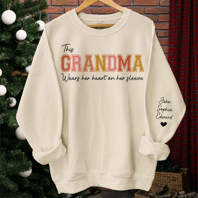 Mommy‘s Heart Belongs To - Family Personalized Custom Unisex Sweatshirt With Design On Sleeve